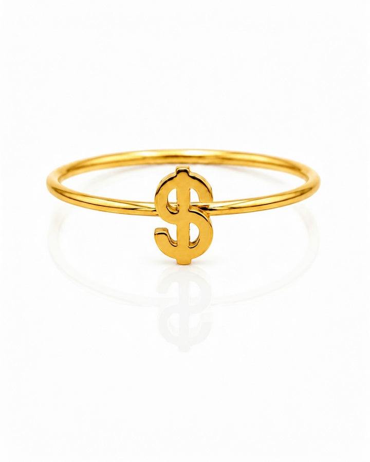 Elli Jewellery gold plated waterproof statement ring featuring a dollar sign symbol on a thin band