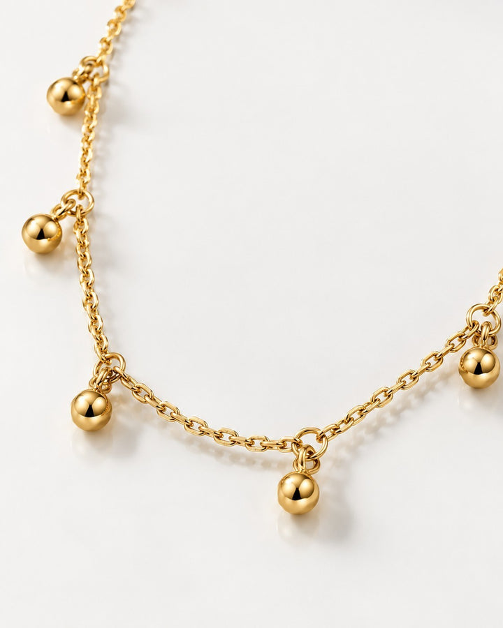 Elli Jewellery gold plated choker necklace featuring delicate chain links and dangling polished dot charms.