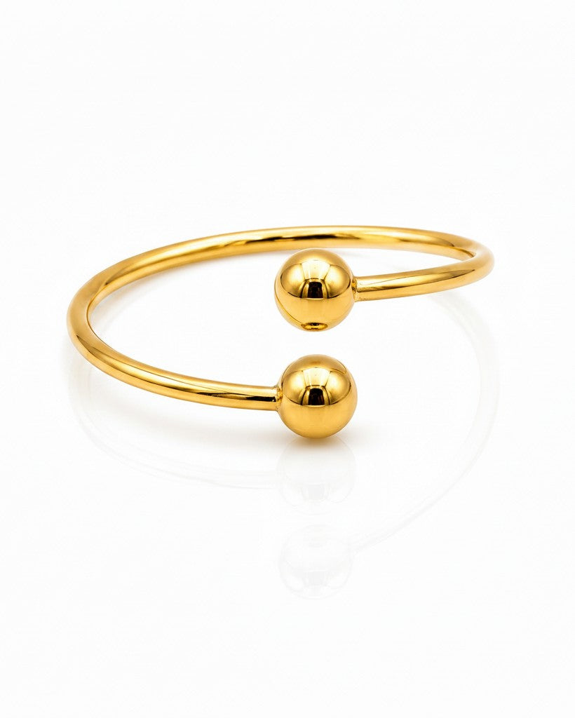 Elli Jewellery gold plated minimalist ring featuring a sleek open design with two polished spheres.