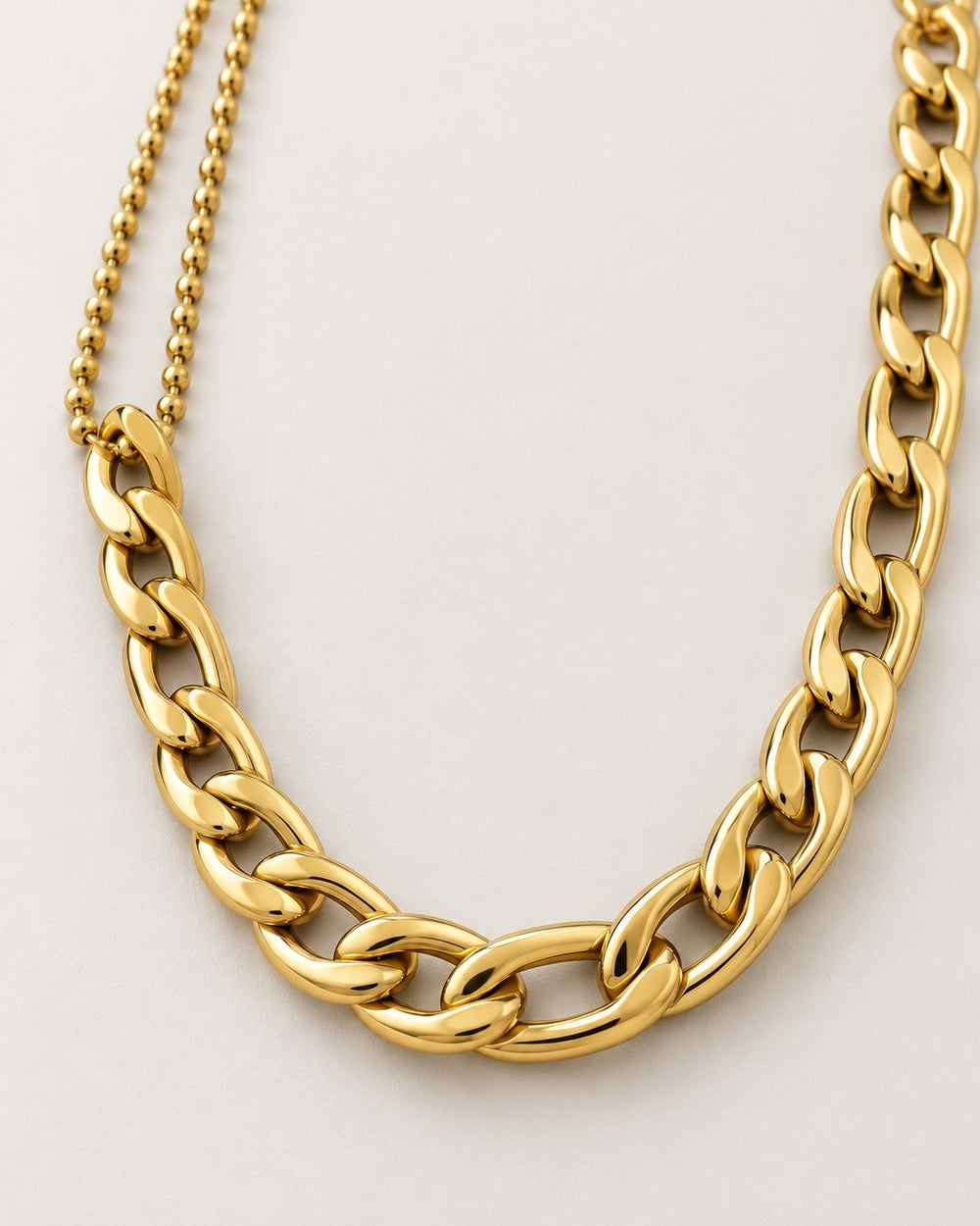 Elli Jewellery gold plated waterproof dual chain necklace featuring a delicate ball chain and a chunky Figaro link.
