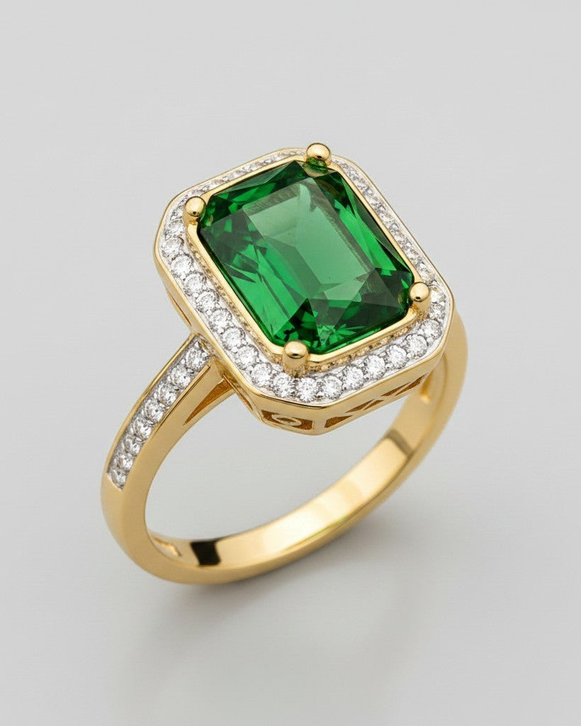 Elli Jewellery gold plated ring featuring a large emerald green rectangular stone surrounded by a halo of small crystals