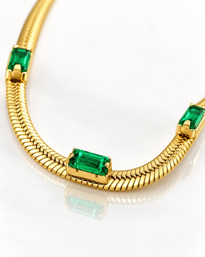 Elli Jewellery gold plated snake chain necklace featuring emerald green rectangular cubic zirconia stones.