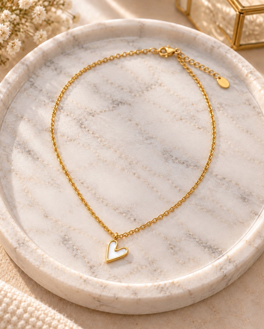 Elli Jewellery gold plated necklace featuring a delicate white enamel heart pendant on a fine chain