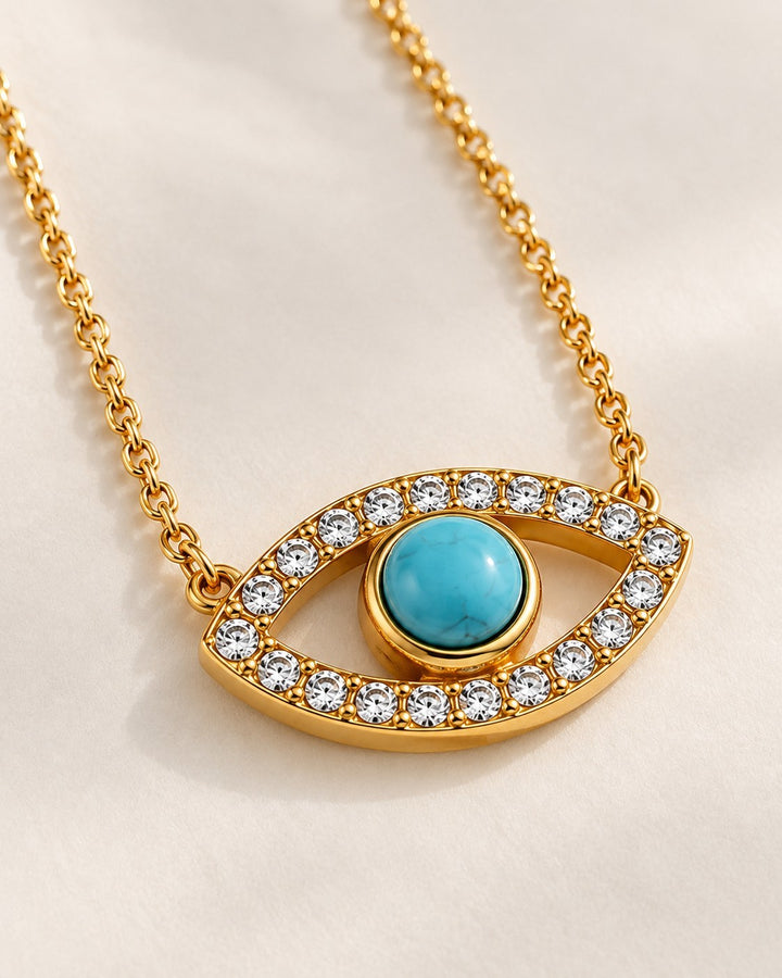 Elli Jewellery gold-plated evil eye necklace featuring a central turquoise stone surrounded by clear zirconia crystals