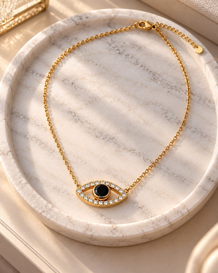 Elli Jewellery gold plated evil eye pendant necklace with a central black stone and sparkling zirconia crystals
