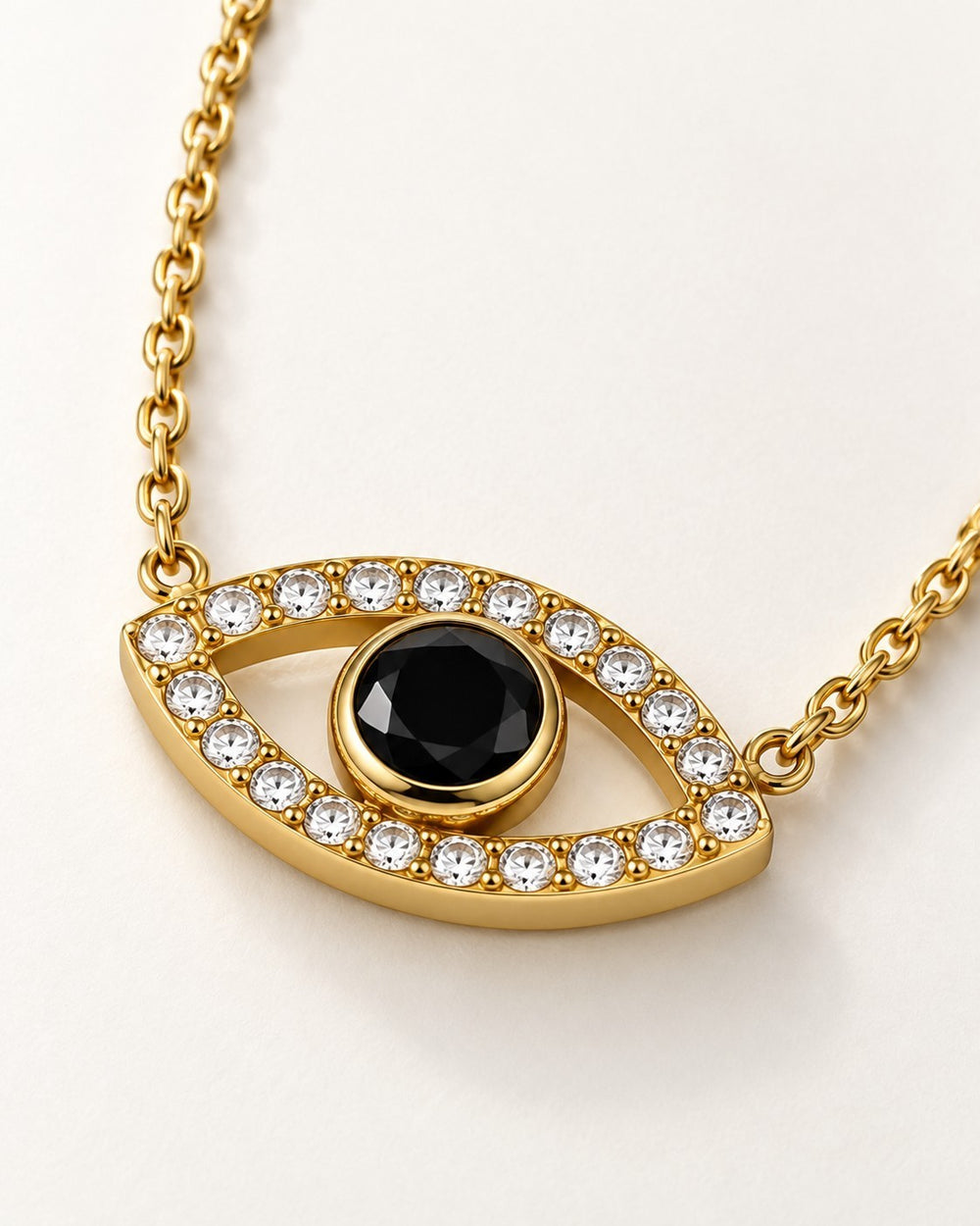Elli Jewellery gold plated evil eye pendant necklace with a central black stone and sparkling zirconia crystals