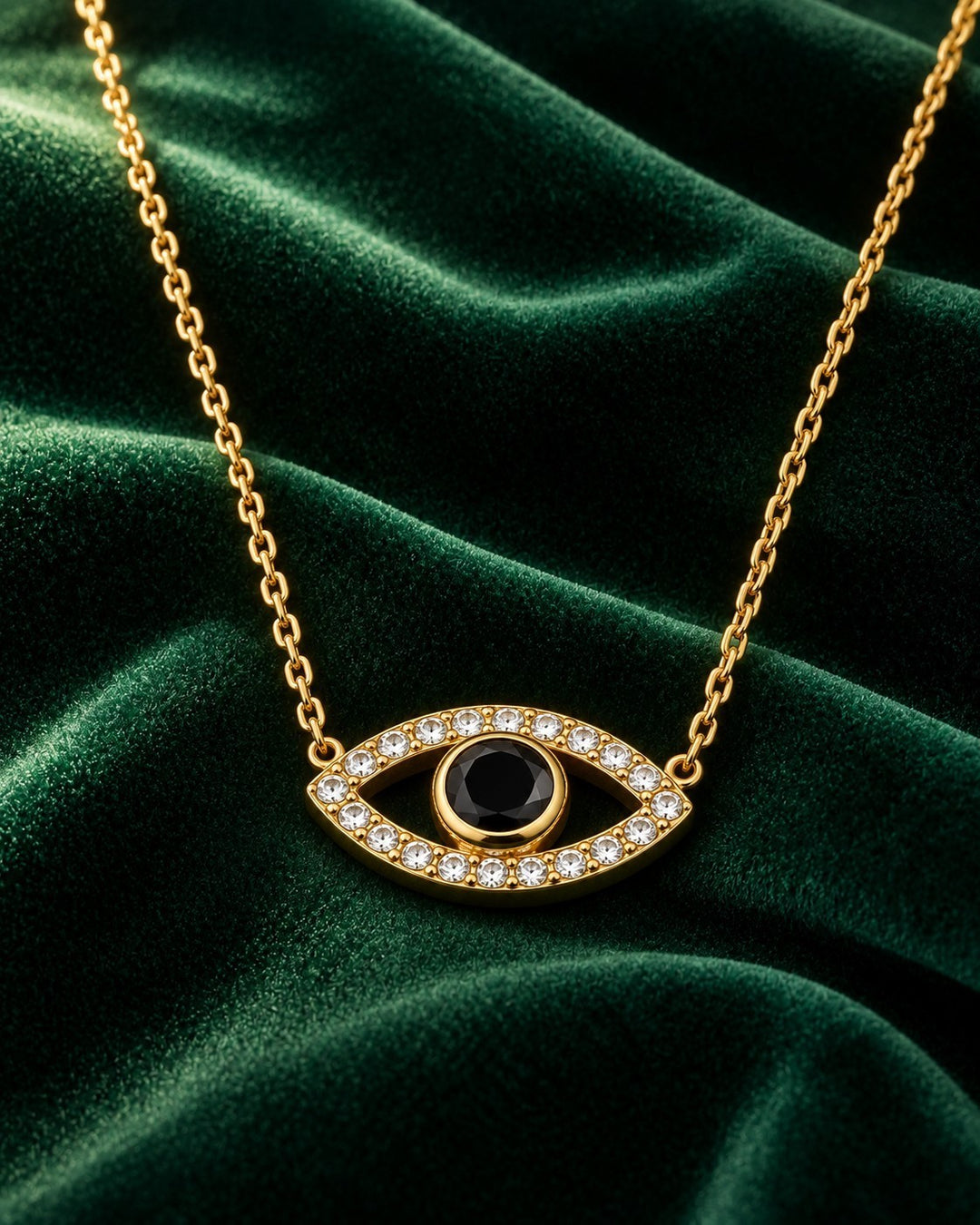 Elli Jewellery gold plated eye pendant necklace with a central black stone and sparkling zirconia crystals.