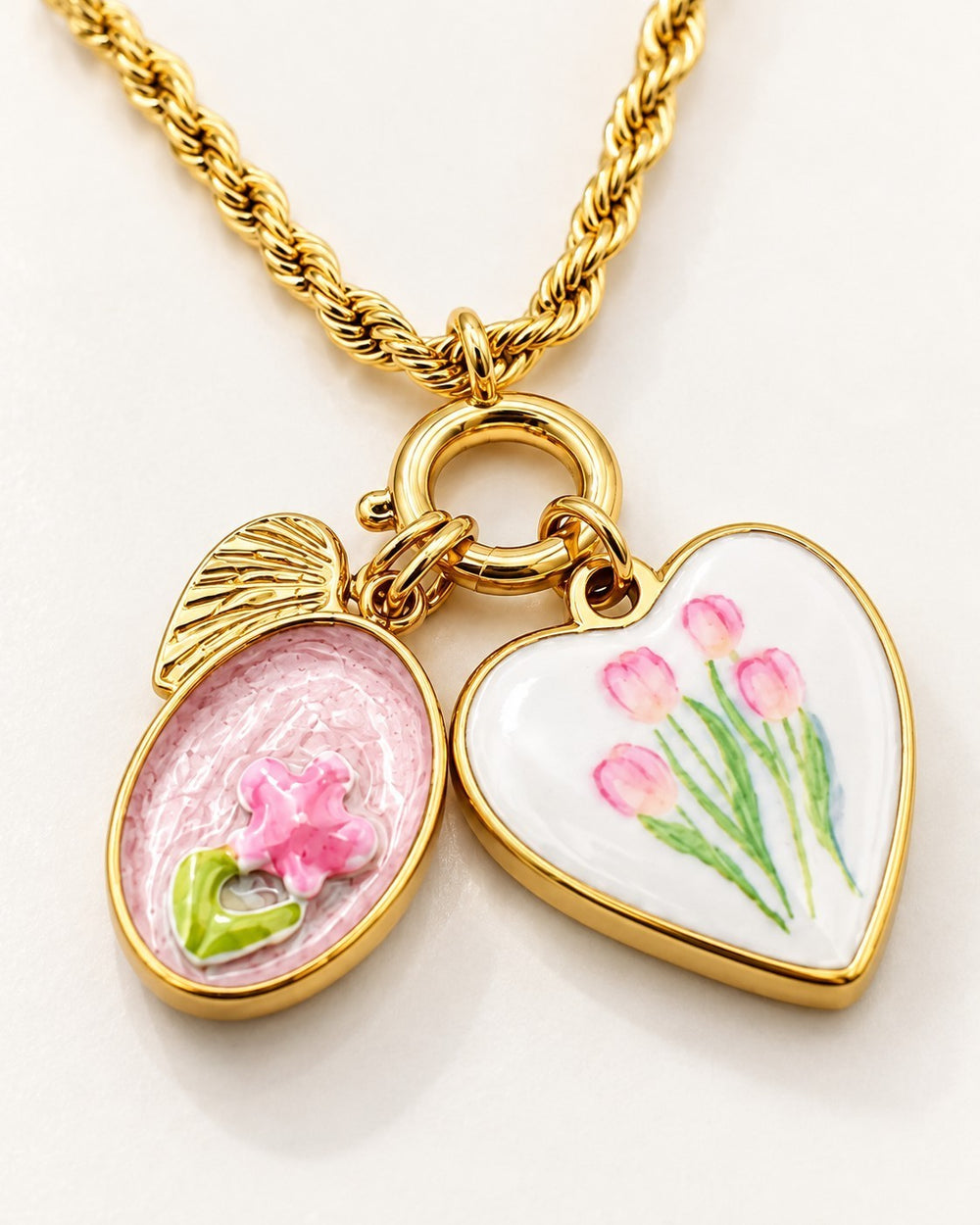 Elli Jewellery gold plated rope chain necklace featuring a heart pendant with tulips and a floral oval charm.