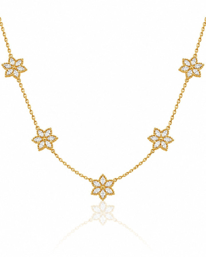 Elli Jewellery gold plated necklace featuring five delicate floral bloom pendants with clear crystal accents.