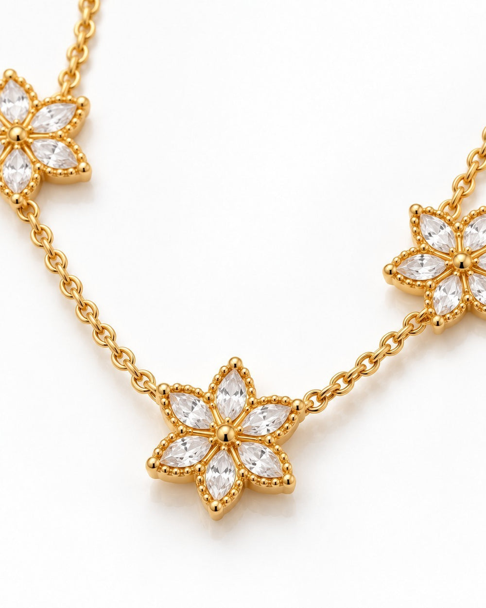 Elli Jewellery gold plated necklace featuring delicate floral bloom pendants with sparkling marquise-cut crystals