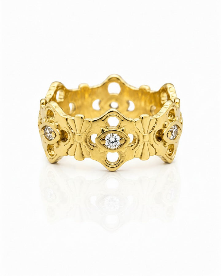 Elli Jewellery gold plated hollow floral statement ring with embedded crystals on a white background.