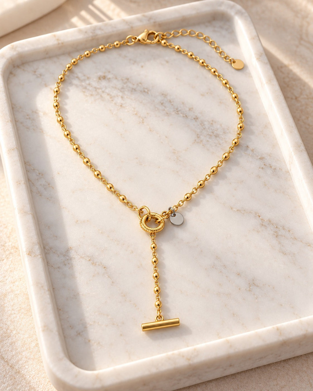 Elli Jewellery gold plated waterproof necklace featuring a geometric circle and bar pendant on a delicate bead chain.