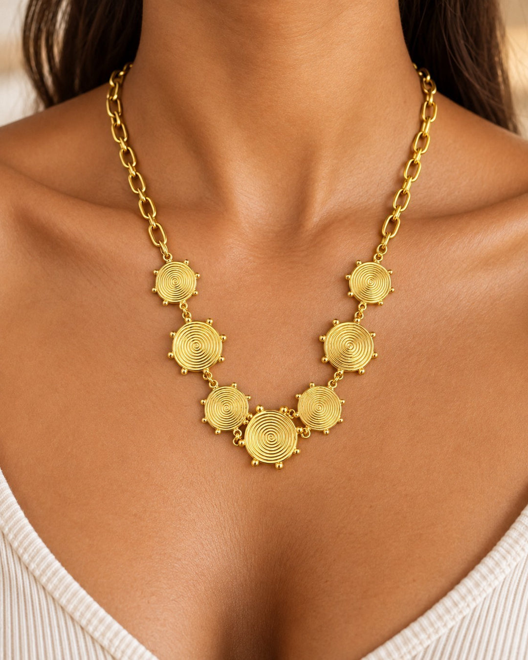 Elli Jewellery gold plated waterproof necklace featuring geometric spiral circle links on a chunky chain