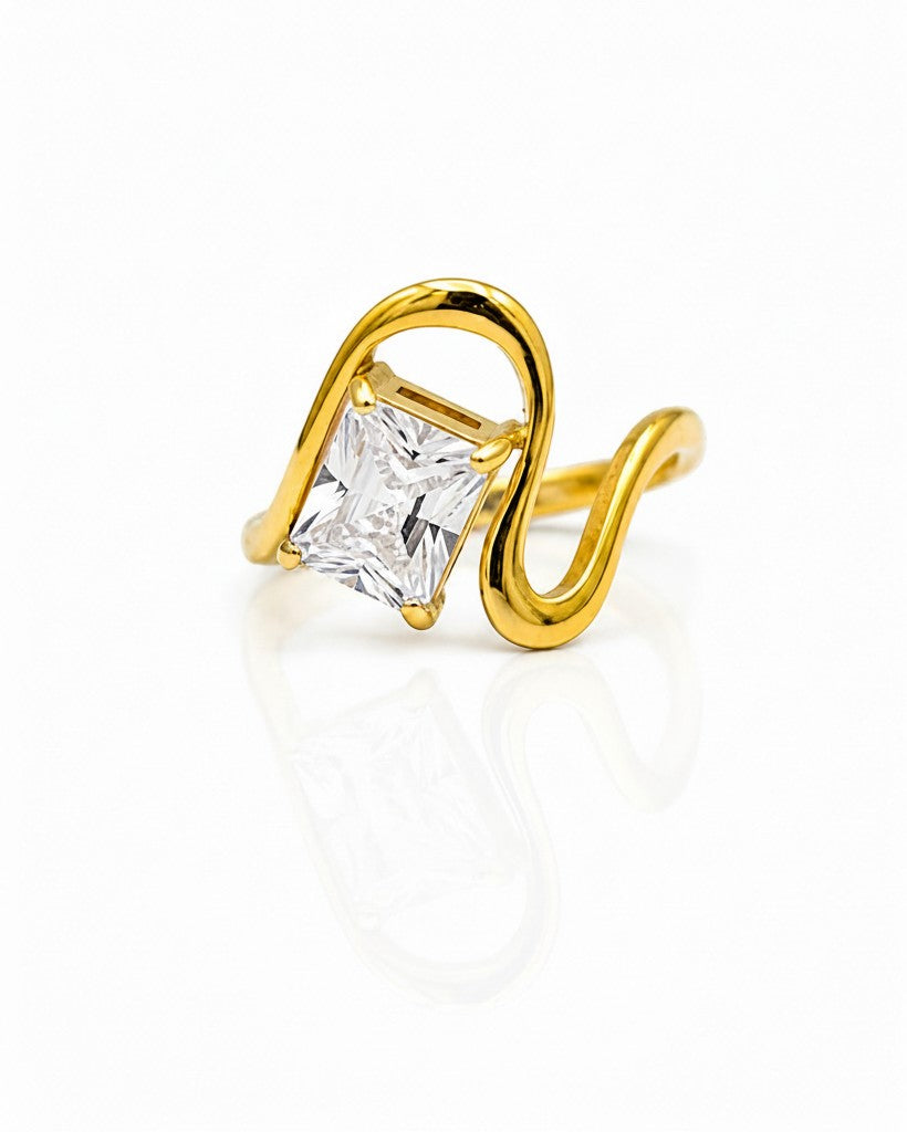 Elli Jewellery gold plated ring featuring a geometric wave band and a sparkling rectangular cut stone.