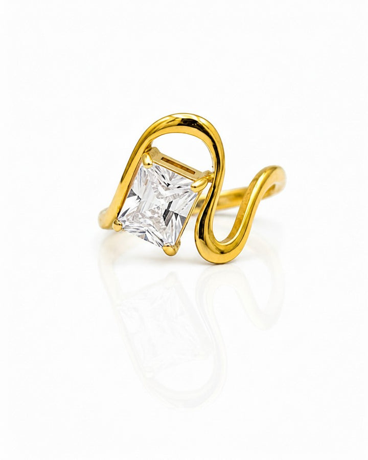 Elli Jewellery gold plated ring featuring a geometric wave band and a sparkling rectangular cut stone.