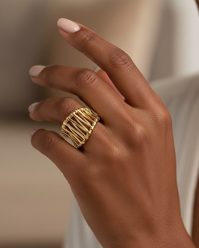 Elli Jewellery gold plated hollow geometric statement ring worn on a finger, showcasing a modern, bold design.