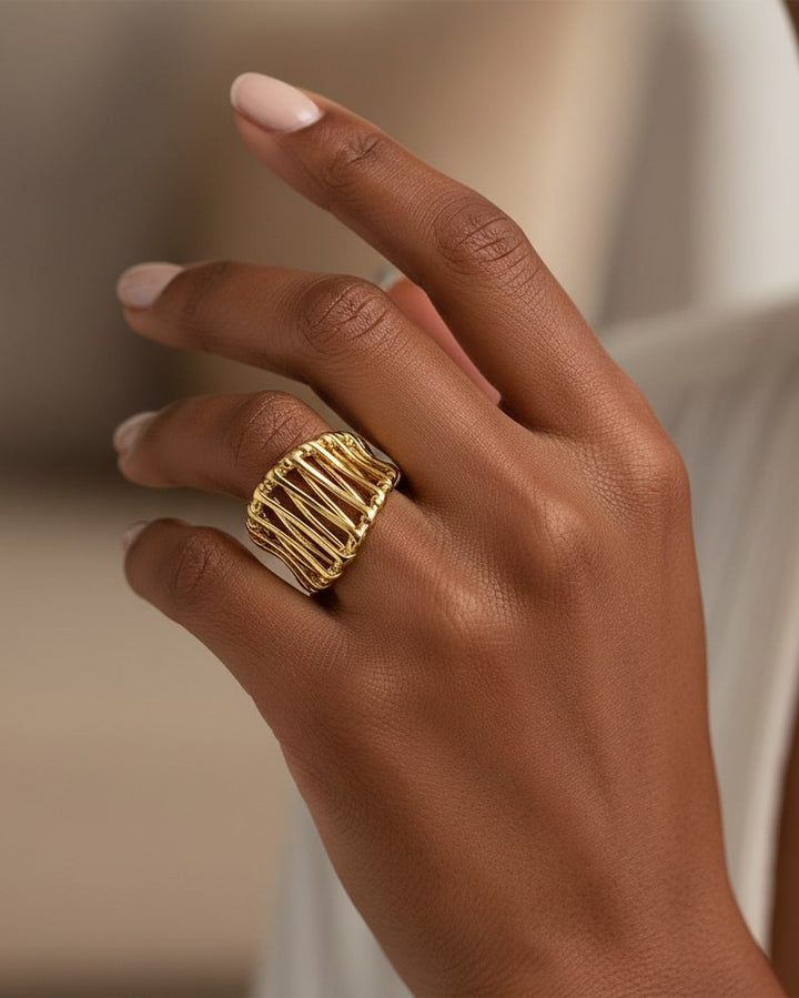 Elli Jewellery gold plated hollow geometric statement ring worn on a finger, showcasing a modern, bold design.