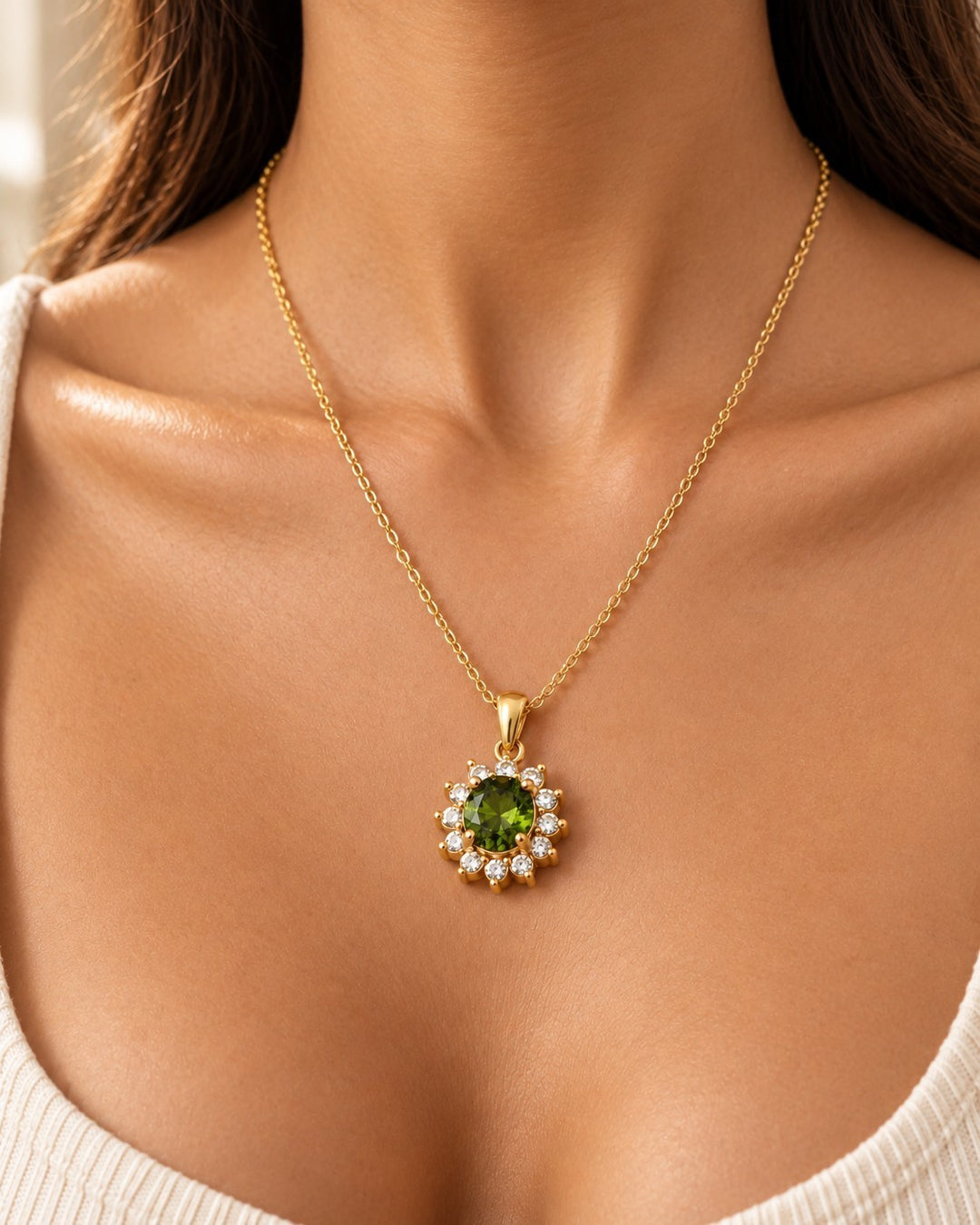 Elli Jewellery gold plated necklace featuring a round emerald green crystal surrounded by a halo of clear stones.