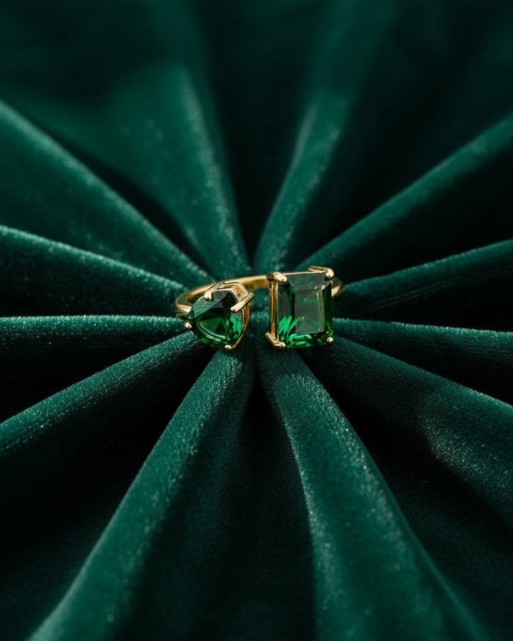 Elli Jewellery gold plated adjustable ring with emerald-cut and pear-cut green cubic zirconia stones on velvet