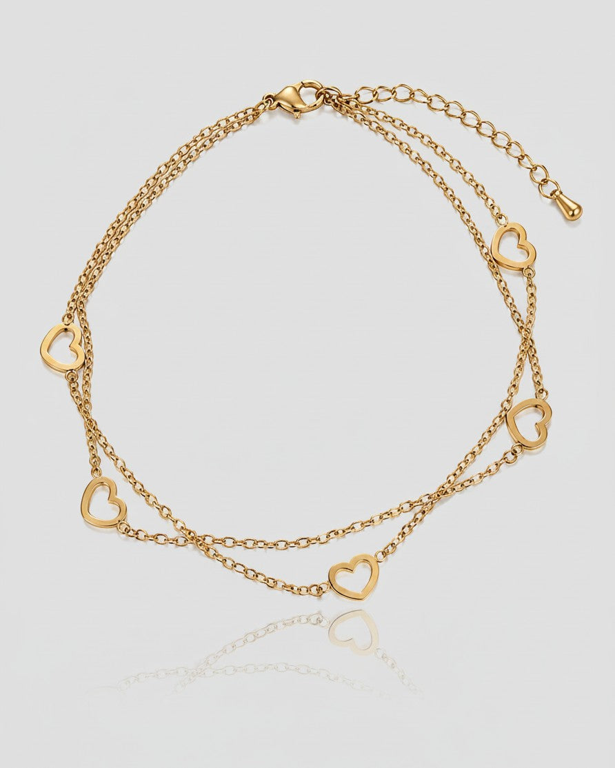 Elli Jewellery gold-toned double chain anklet featuring delicate open heart charms and a lobster clasp closure.