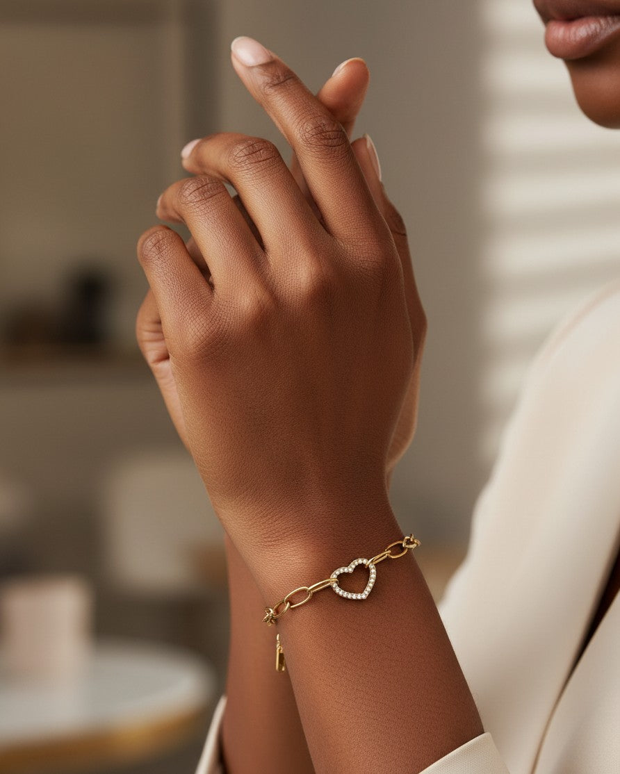 Elli Jewellery gold plated waterproof bracelet featuring a hollow heart charm with sparkling diamanté accents.