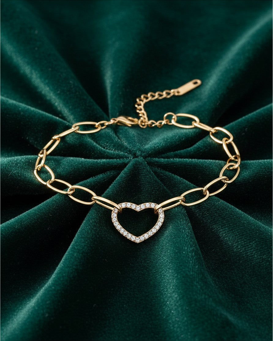 Elli Jewellery gold plated waterproof chain bracelet featuring a hollow heart charm with sparkling diamanté stones.