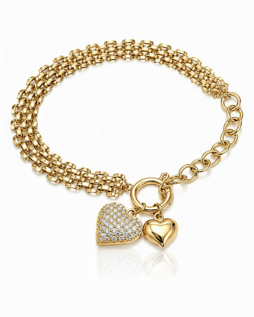 Elli Jewellery gold plated chain bracelet featuring a pavé crystal heart charm and a polished gold heart pendant.