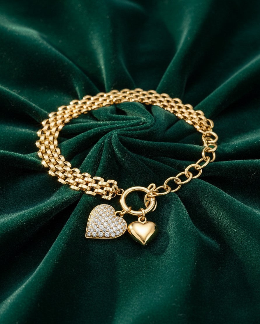 Elli Jewellery gold plated chain bracelet featuring a pavé crystal heart and a smooth polished heart charm
