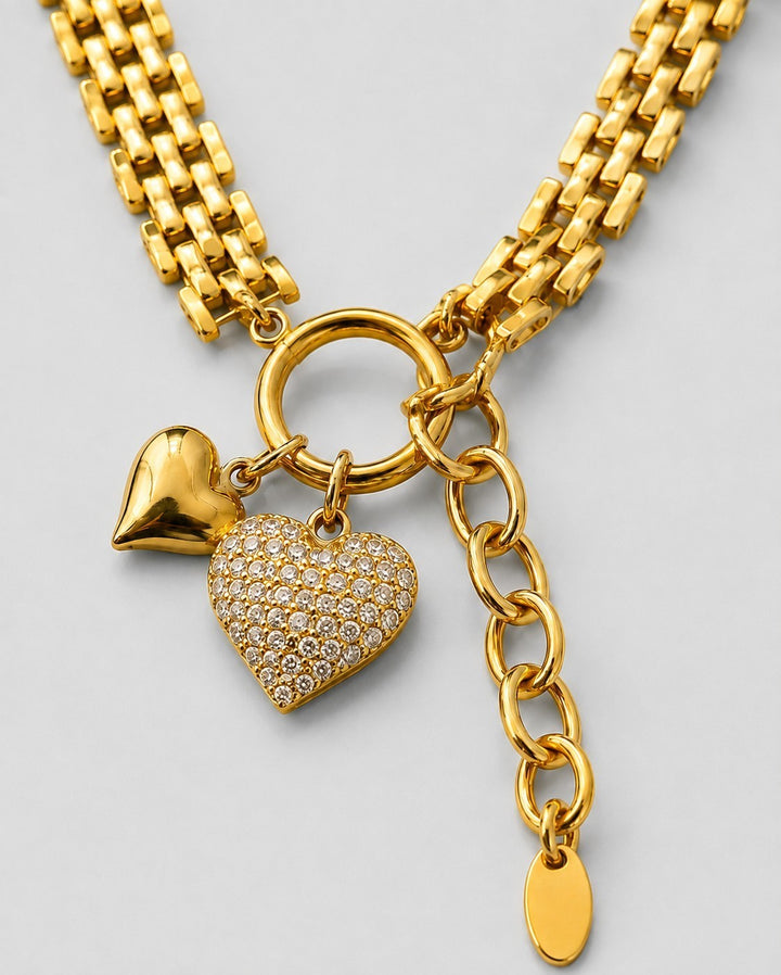 Elli Jewellery gold plated waterproof necklace featuring a crystal-encrusted heart charm and a smooth heart pendant.