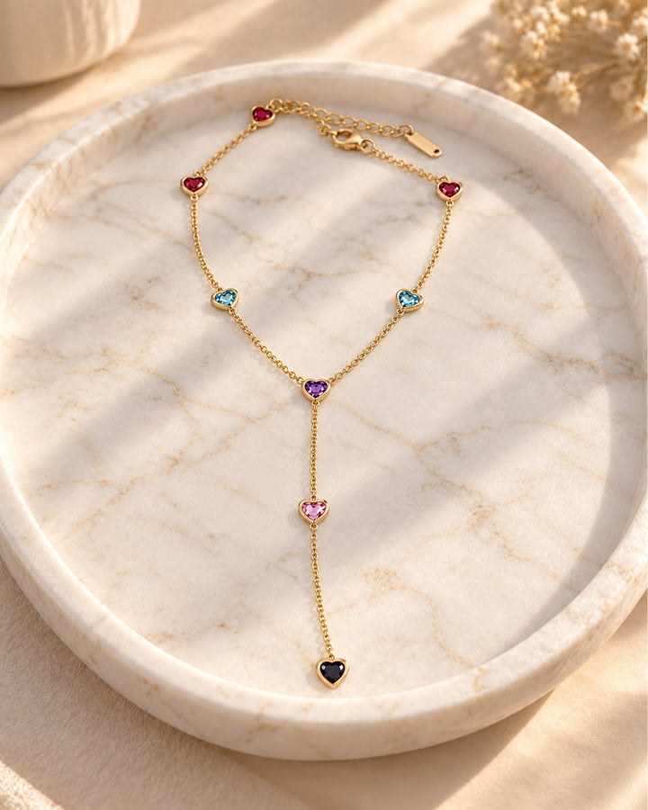 Elli Jewellery gold-plated Y-shaped necklace featuring colourful heart-shaped beads on a delicate waterproof chain