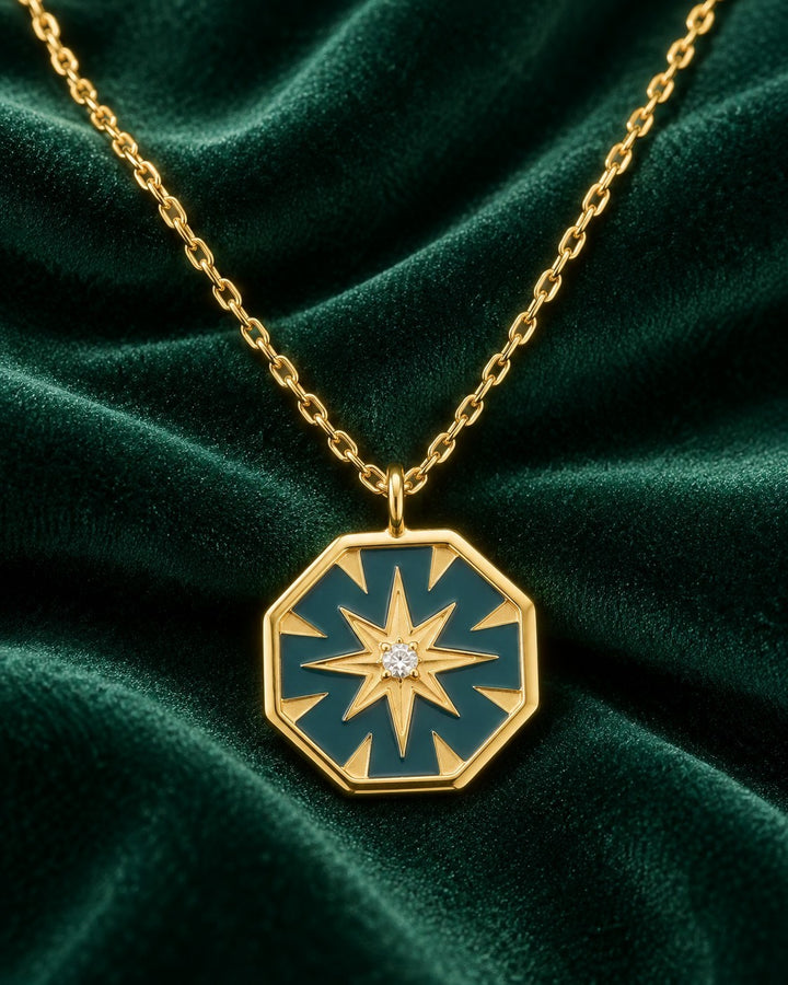 Elli Jewellery gold plated waterproof hexagon pendant necklace with mint enamel inlay and a central star motif.