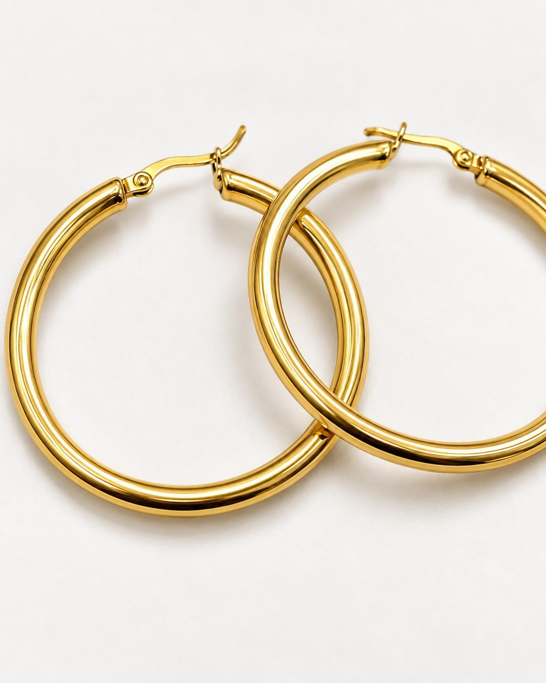 Elli Jewellery 40mm gold-toned hoop earrings with a polished finish on a clean white background.