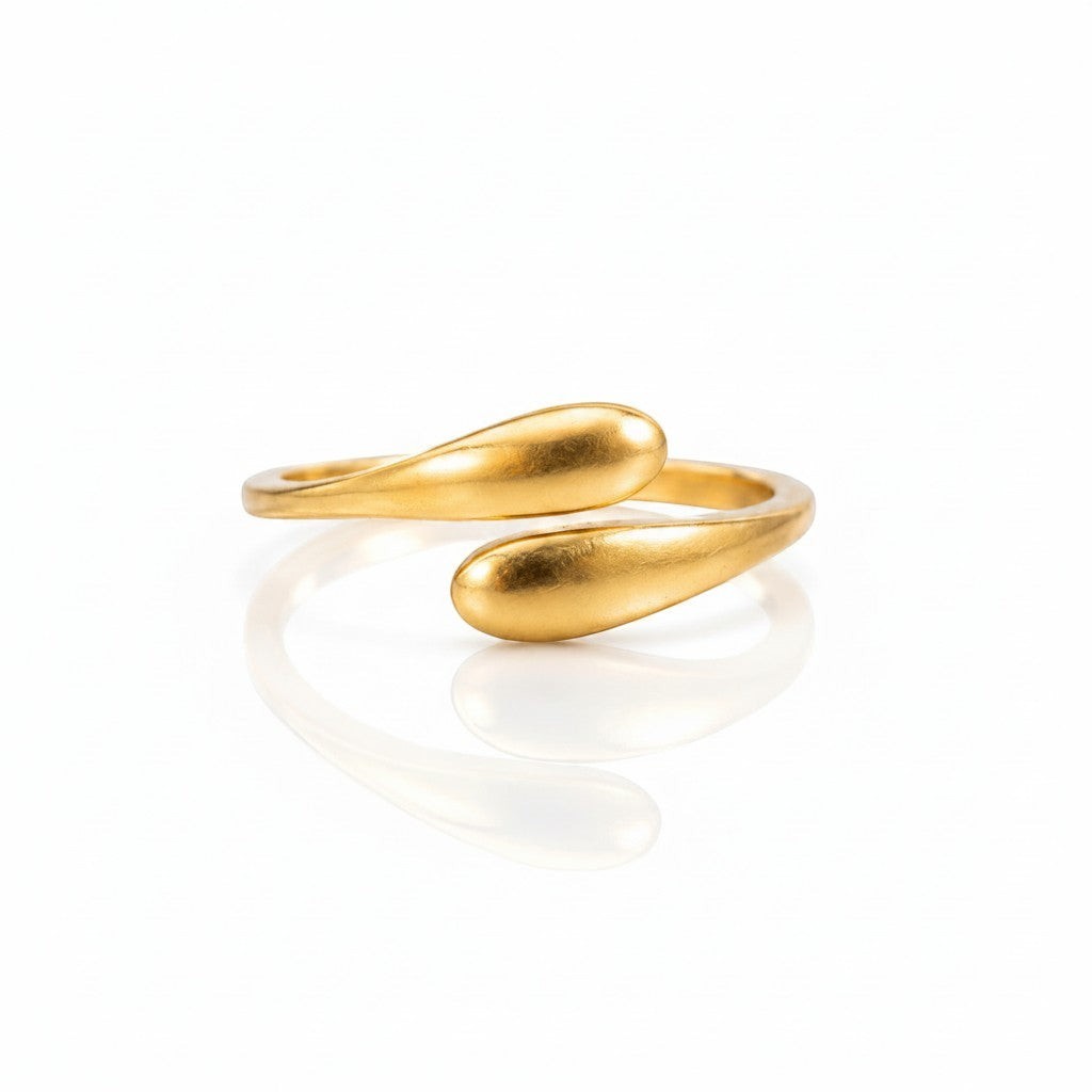 Elli Jewellery gold plated minimalist hug wrap ring with a sleek sculptural design on a white background.