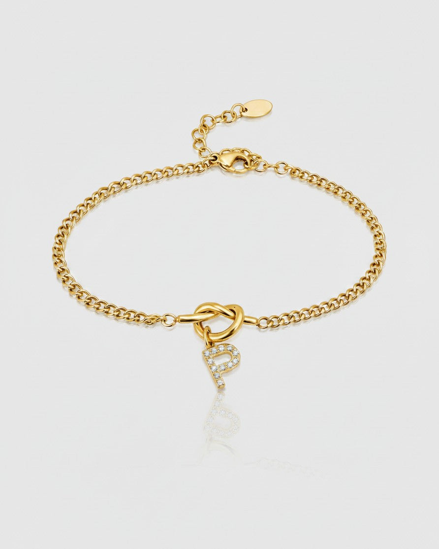 Elli Jewellery gold plated chain bracelet featuring a sparkling diamante letter P charm on a knot detail