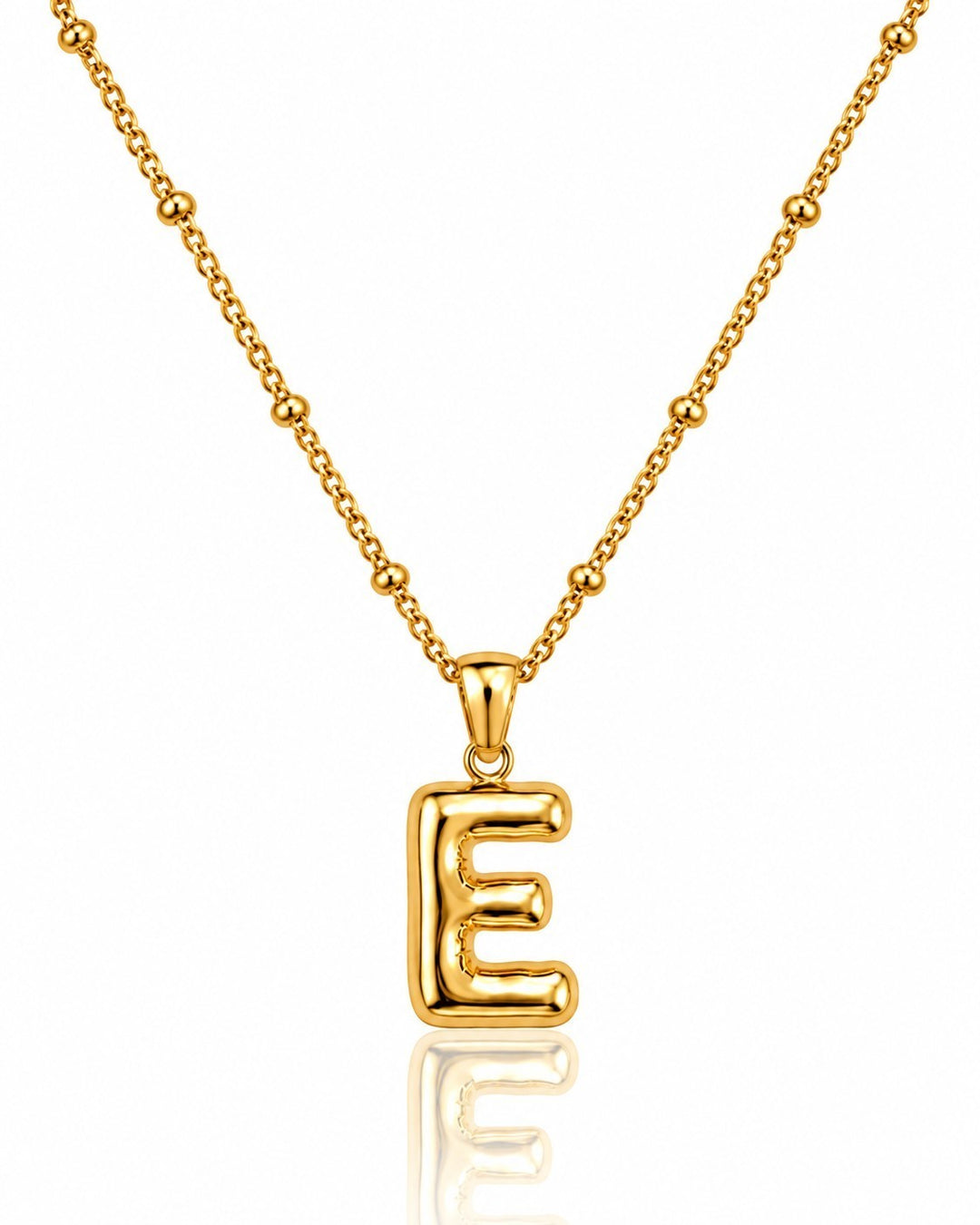 Elli Jewellery gold plated chunky initial E pendant necklace on a beaded chain against a white background