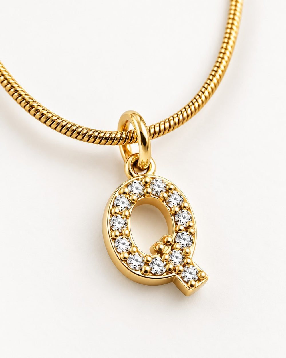 Elli Jewellery gold plated initial Q pendant necklace featuring sparkling crystals on a delicate snake chain