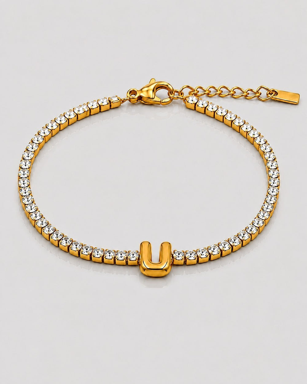 Elli Jewellery gold plated waterproof tennis bracelet featuring a sparkling crystal initial U charm on an adjustable chain