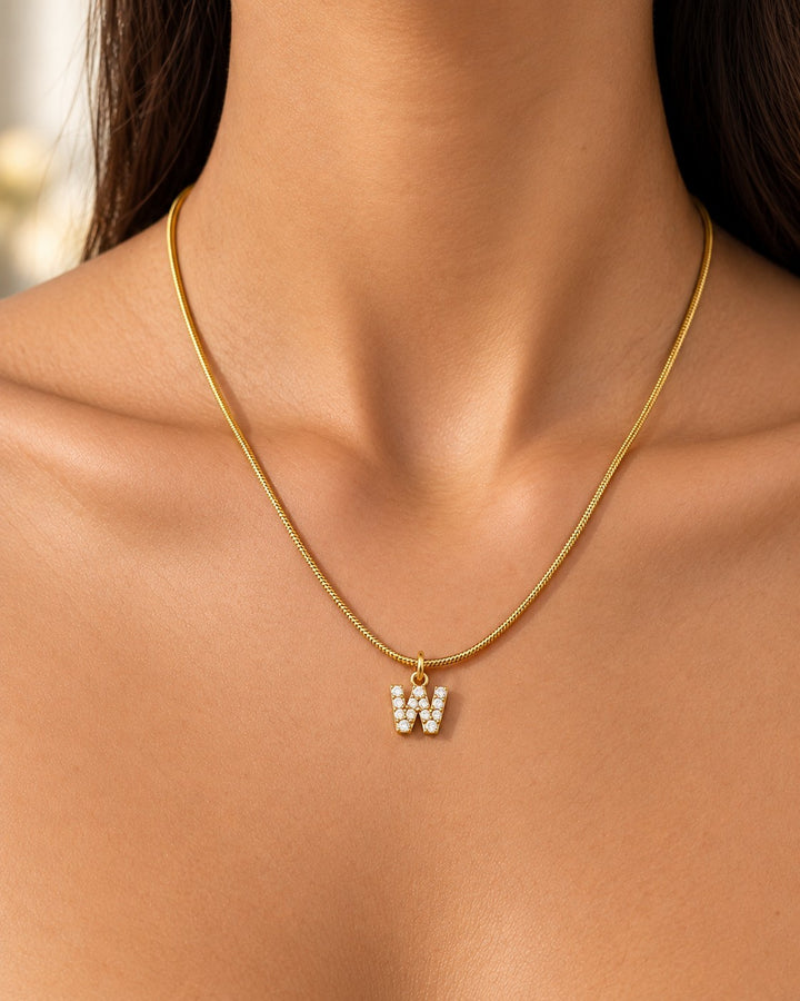 Elli Jewellery gold plated waterproof initial W pendant necklace with sparkling stones on a delicate chain