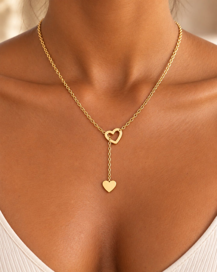 Elli Jewellery gold plated waterproof necklace featuring two interlocking hearts on a delicate threaded chain.