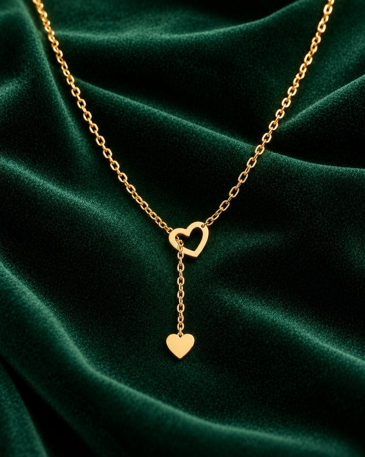 Elli Jewellery gold plated waterproof necklace featuring two delicate interlocking hearts on a sleek threaded chain.