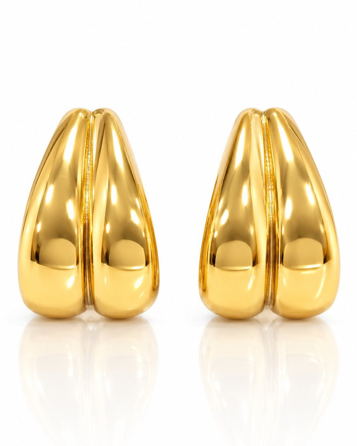 Elli Jewellery gold plated stainless steel interlocking double C hoop earrings with a sculptural, waterproof design.