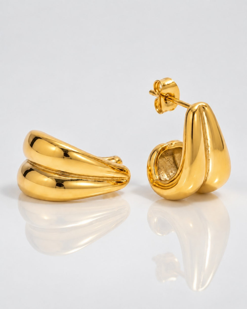Elli Jewellery gold plated stainless steel interlocking double C hoop earrings with a polished sculptural finish
