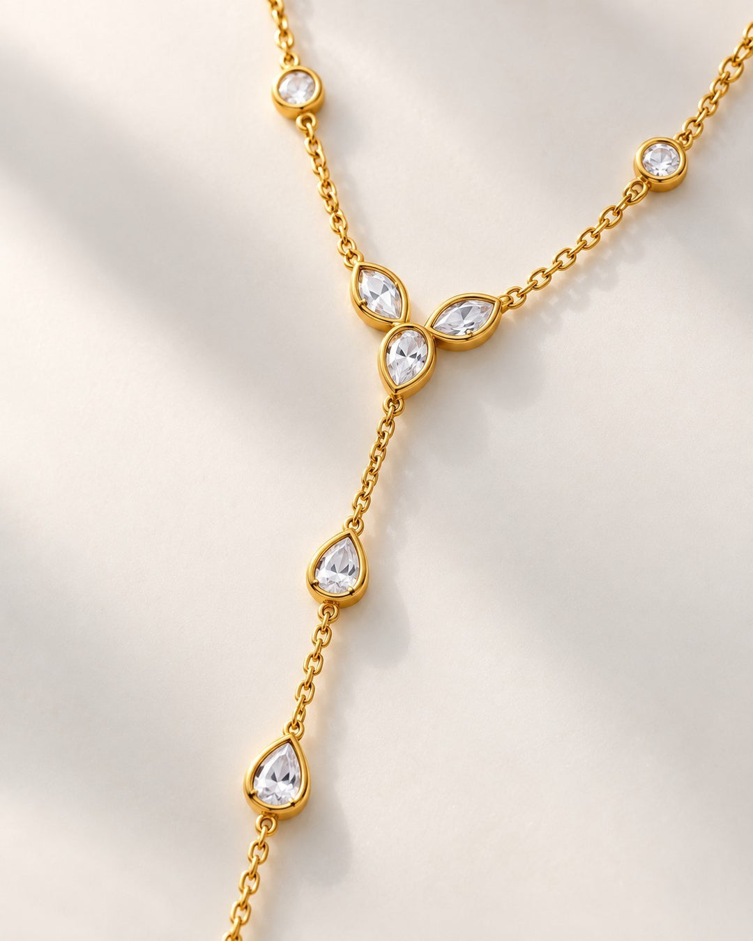 Elli Jewellery gold plated lariat necklace featuring delicate pear-cut crystal charms on a minimalist chain.