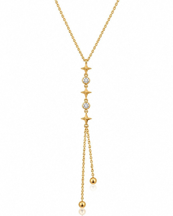 Elli Jewellery gold plated lariat necklace featuring star charms, clear crystals, and delicate dangling ball chains.