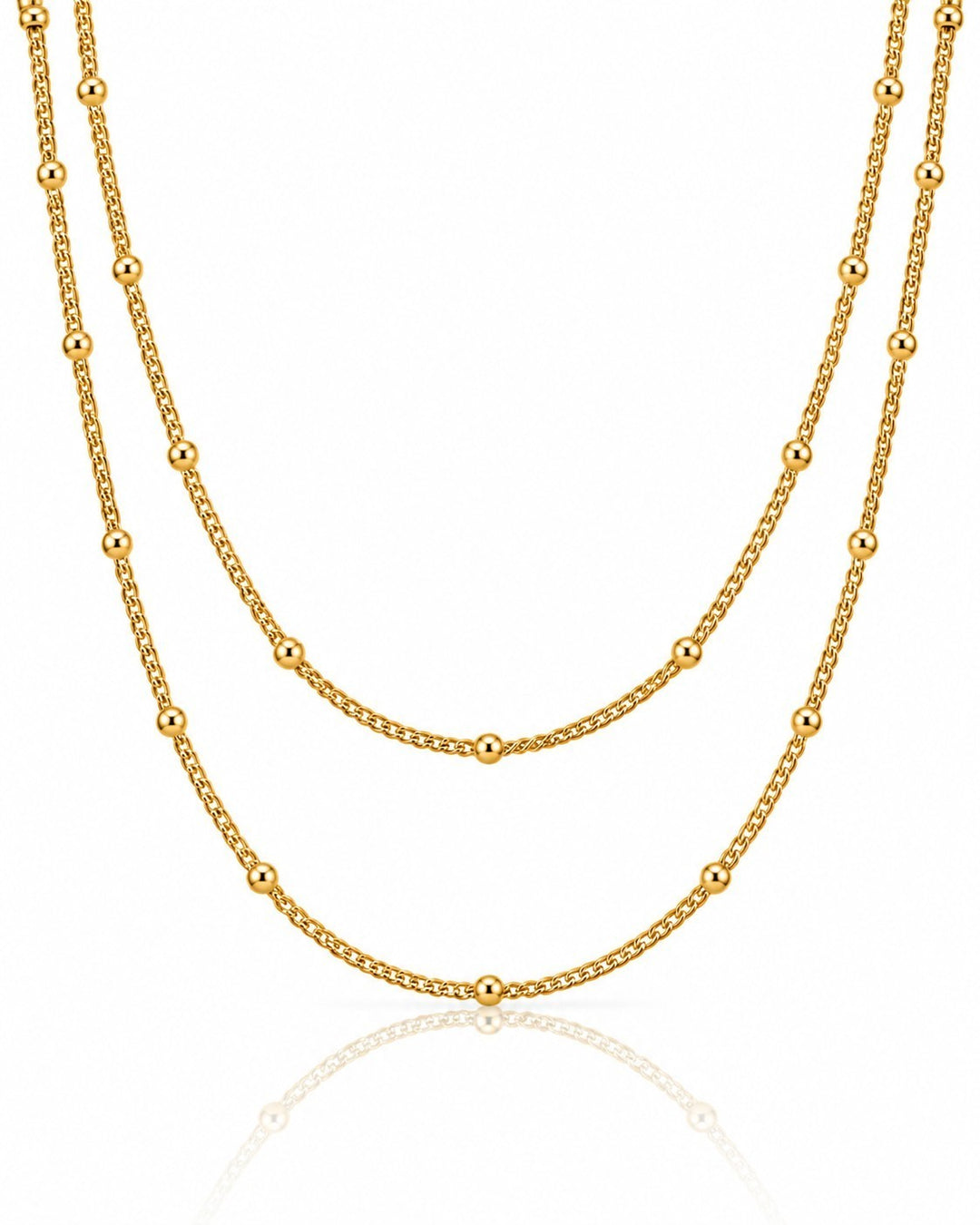 Elli Jewellery gold plated triple layered beaded chain necklace with delicate spheres on a white background