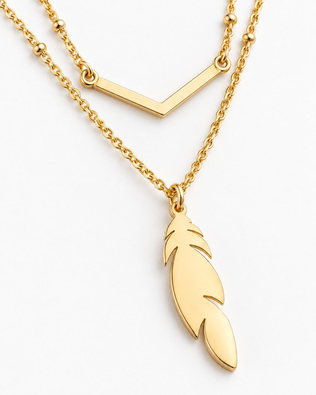 Elli Jewellery gold plated layered necklace featuring a delicate leaf charm and a minimalist chevron bar detail.