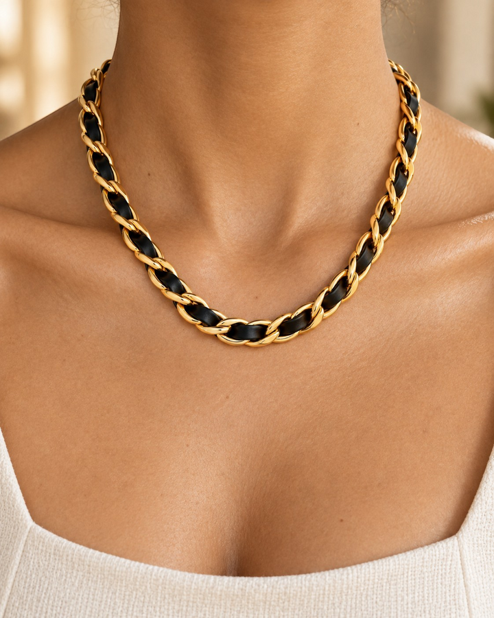Elli Jewellery gold plated curb chain necklace interwoven with black leather worn on a model