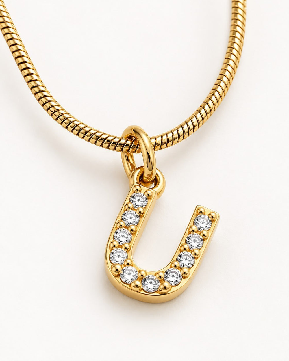 Elli Jewellery gold plated letter U initial pendant necklace with sparkling crystals on a sleek snake chain