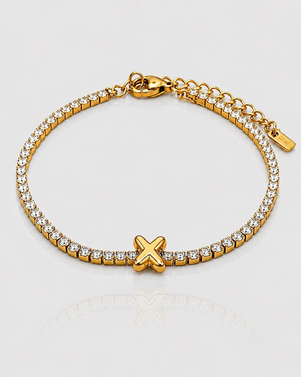 Elli Jewellery gold plated tennis bracelet featuring a central letter X charm and sparkling clear crystals