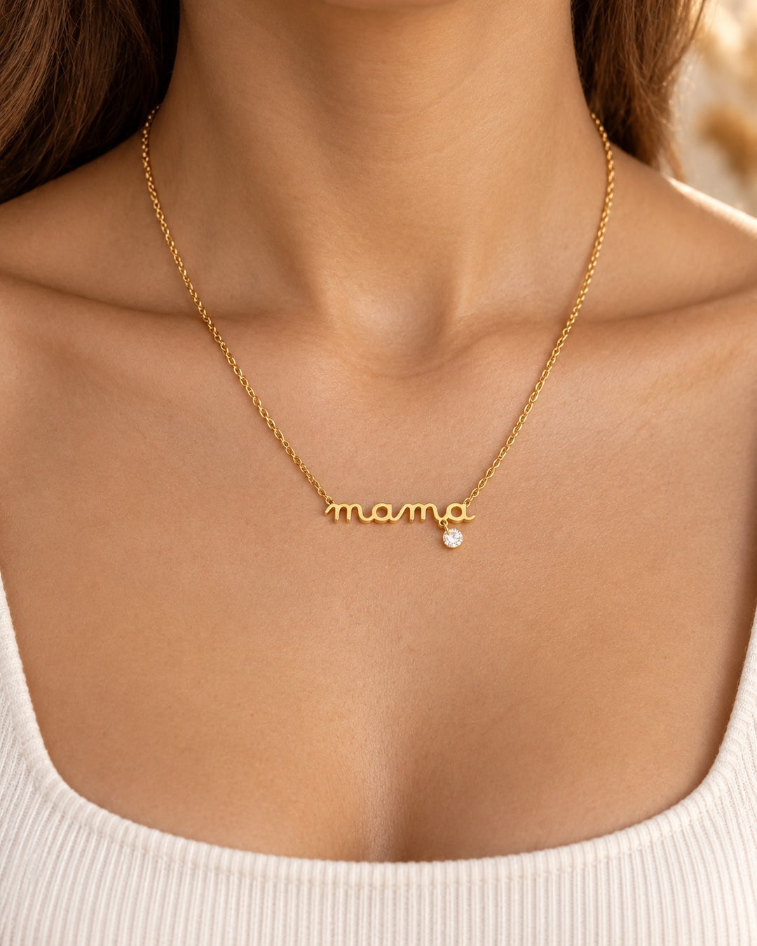 Elli Jewellery gold plated dainty MAMA script pendant necklace with a small sparkling crystal charm on a fine chain